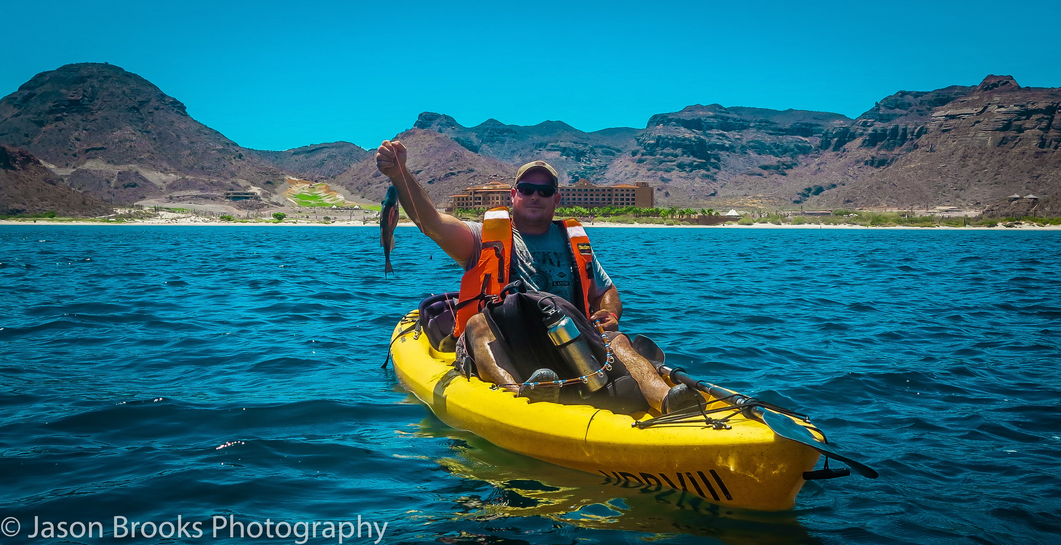 Joe Andrews with one of the over 100 Trigger fish he caught in two days-Jason Brooks